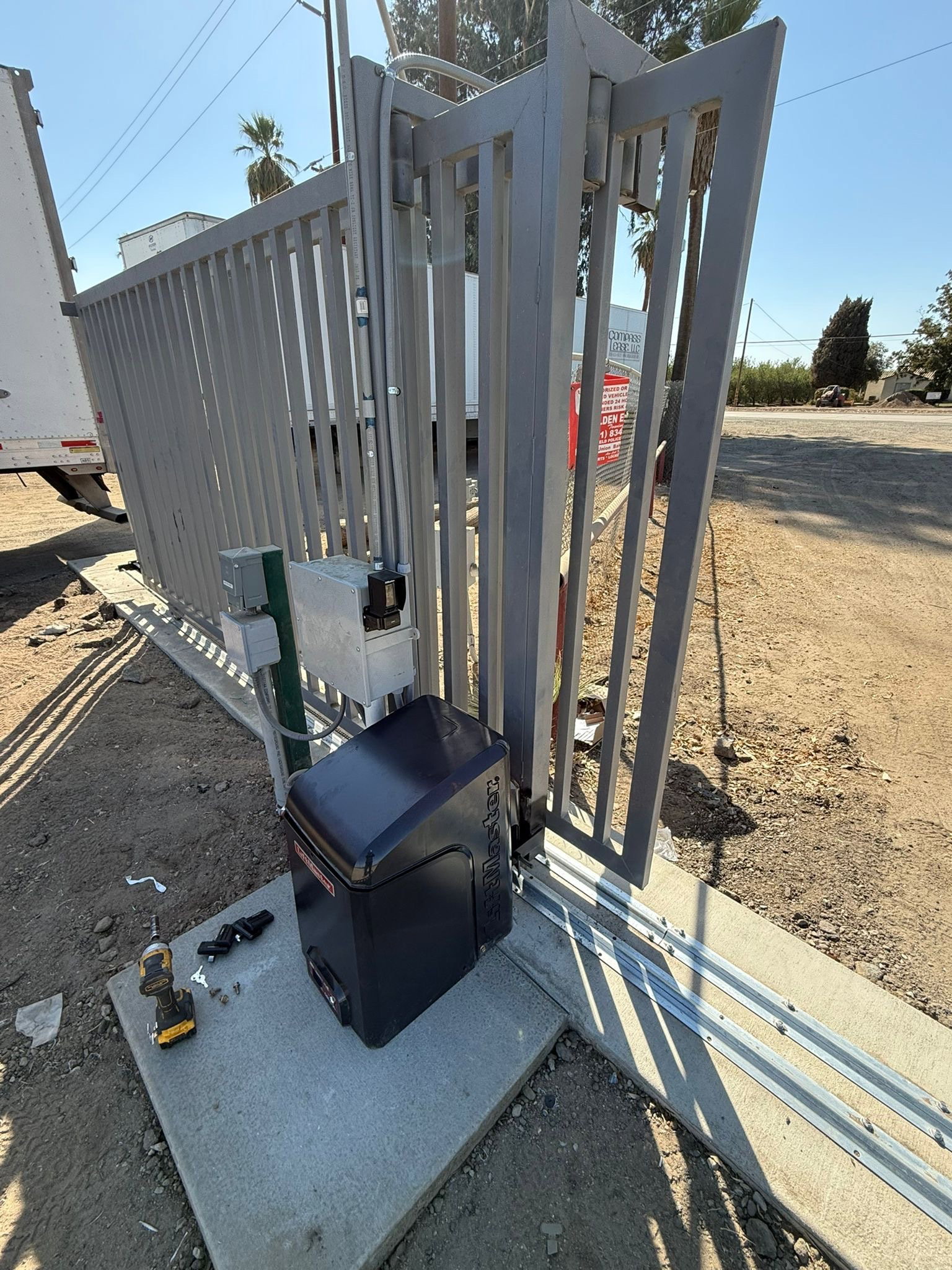 A driveway gate with a newly installed automatic operator serviced across the Inland Empire
