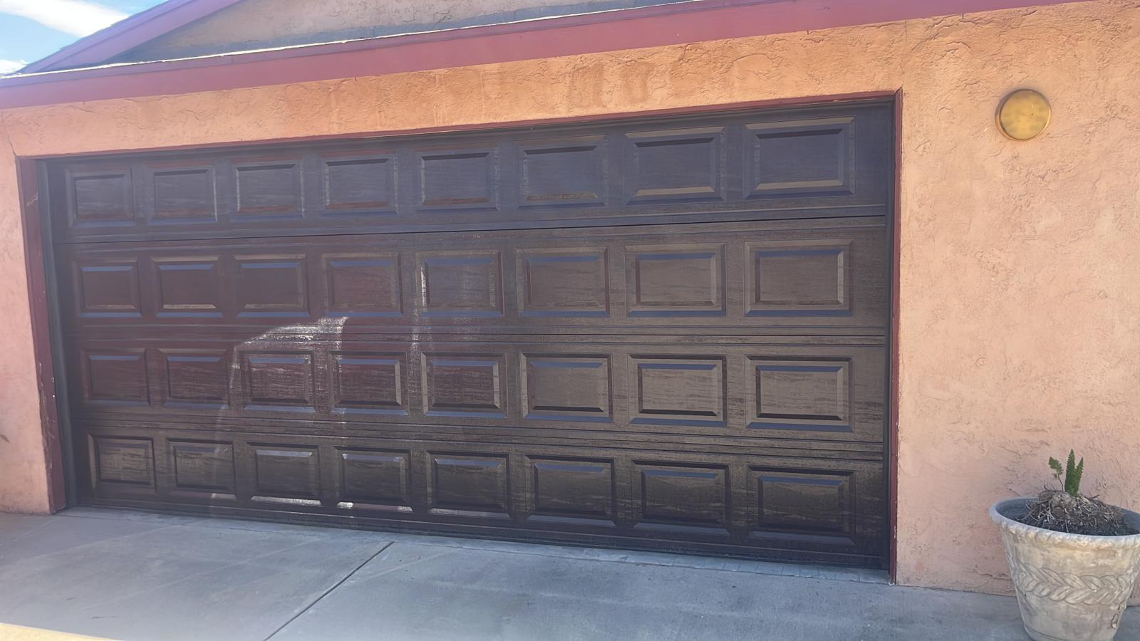 The same garage door after rust removal and restoration, clean and finished