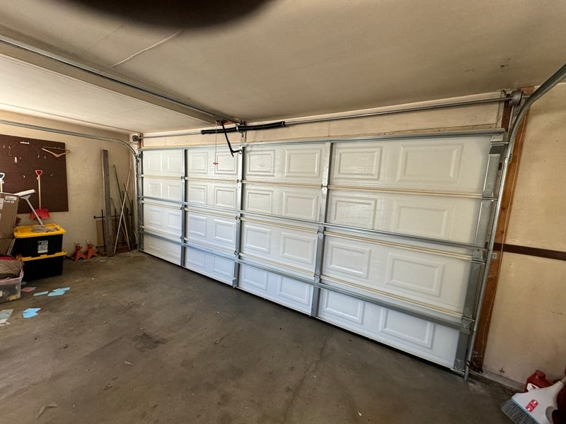White Raised-Panel Door Interior Track Installation, 24/7 Garage Door and Gate Services LLC, Inland Empire CA