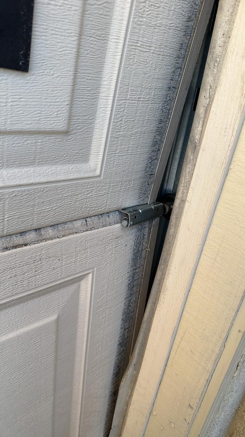 A tilt-up garage door after repair, opening smoothly
