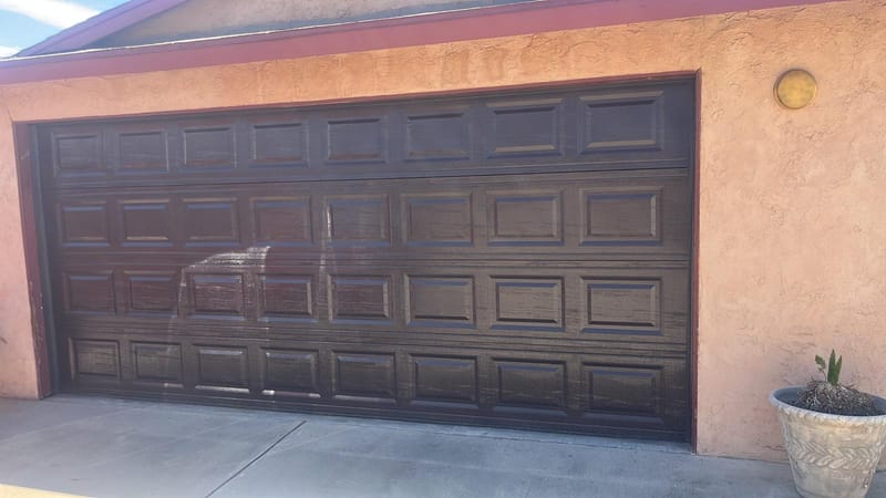 A clean, restored garage door after a repair in Riverside, California