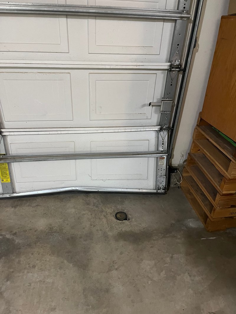 White Raised-Panel Sectional Garage Door Track Repair, 24/7 Garage Door and Gate Services LLC, Inland Empire CA
